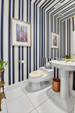 an aerial view of residential houses with outdoor space and a lake view