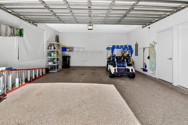 a view of a house with a yard and a garden