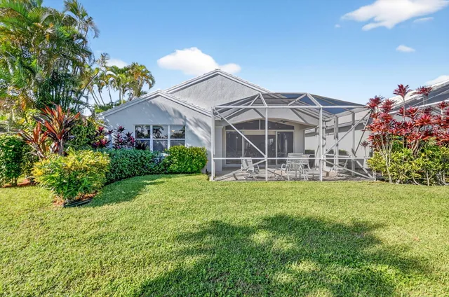 an aerial view of a house with a swimming pool yard and mountain view in back