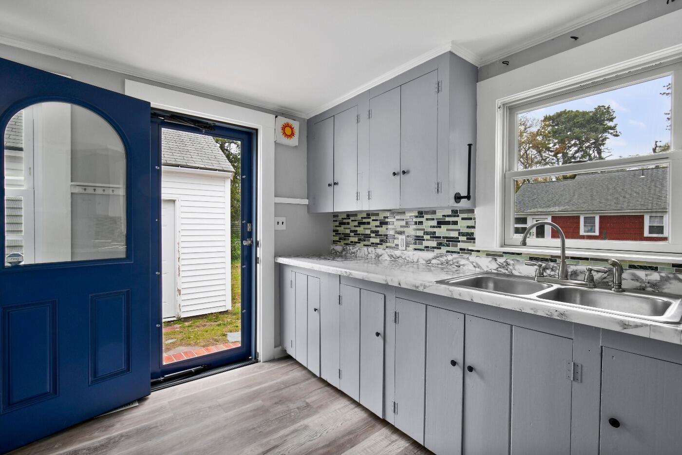 1 Gilbert Road Dennis Port, MA 02639 - Photo 13 of 27 a kitchen with sink and cabinets