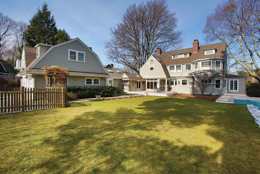 55 Devon Road Brookline, MA 02467 - Photo 12 of 12 a front view of a building with a garden