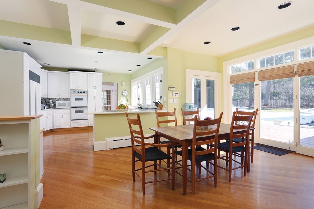 55 Devon Road Brookline, MA 02467 - Photo 7 of 12 a view of a dining area with furniture and wooden floor