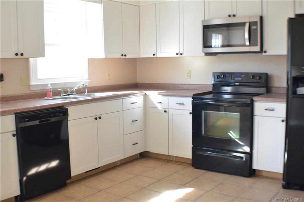 266 Cardinal Road Spindale, NC 28139 - Photo 2 of 15 a kitchen with cabinets and appliances