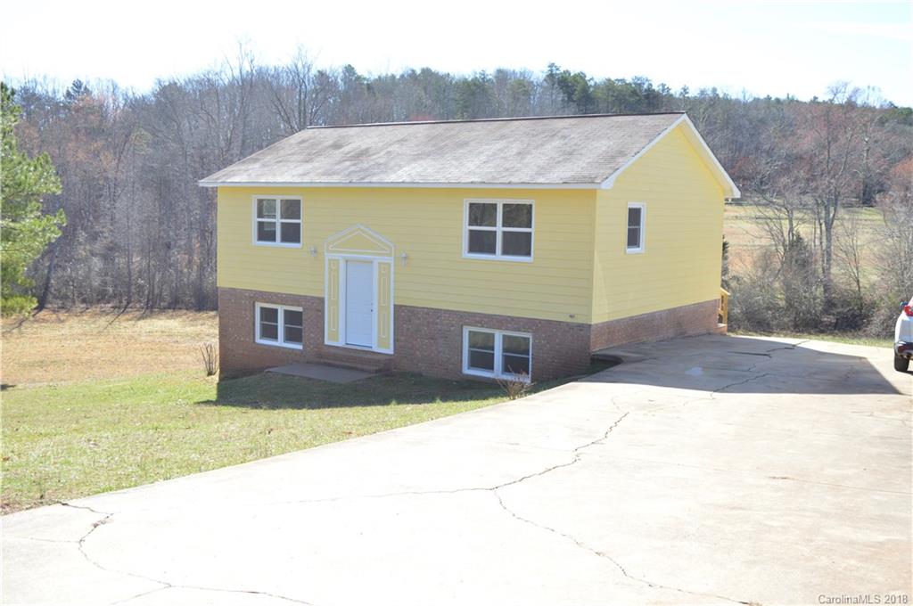 266 Cardinal Road Spindale, NC 28139 - Photo 13 of 15 a aerial view of house with yard and trees in the background