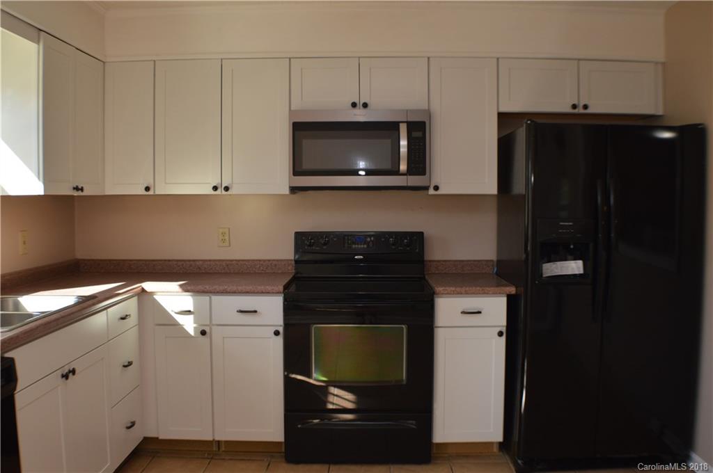 266 Cardinal Road Spindale, NC 28139 - Photo 3 of 15 a kitchen with a stove and a microwave