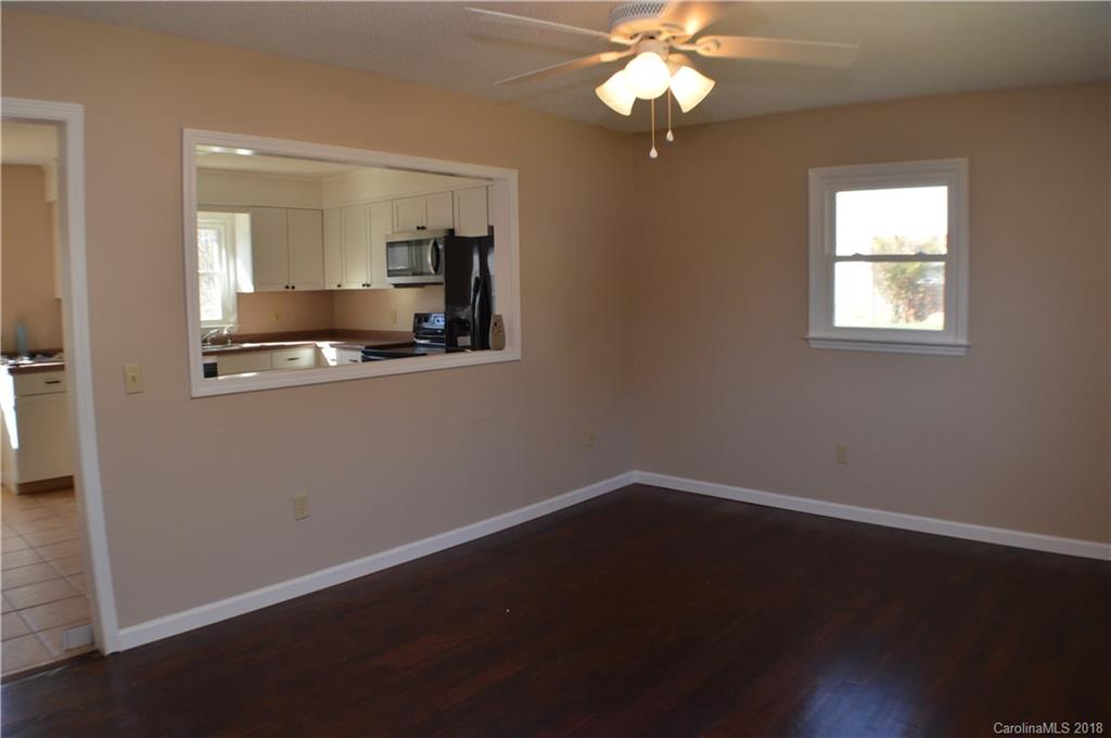 266 Cardinal Road Spindale, NC 28139 - Photo 4 of 15 a view of wooden floor and a chandelier fan in a room