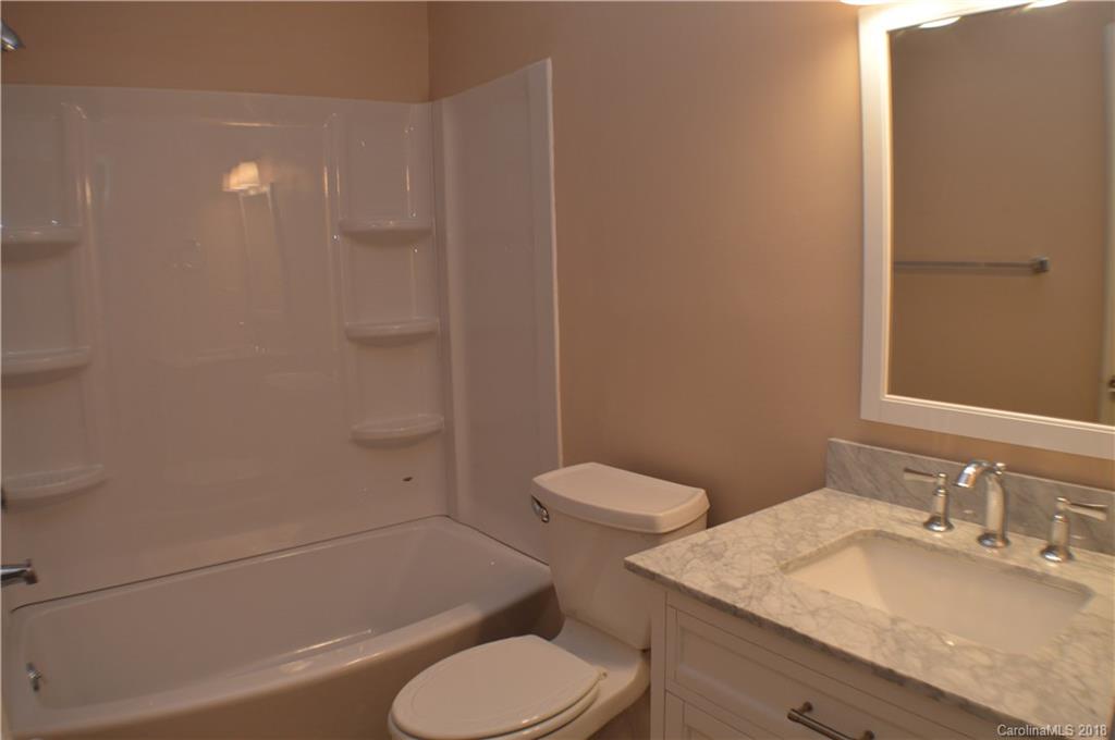 266 Cardinal Road Spindale, NC 28139 - Photo 8 of 15 a bathroom with a granite countertop toilet sink and shower