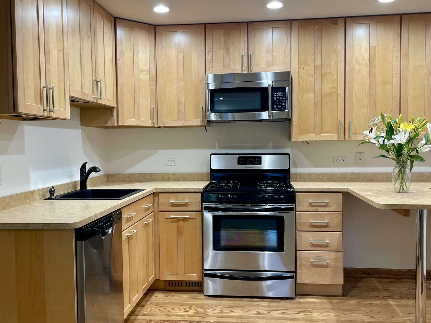 5145 Washington Street, Unit 2 Downers Grove, IL 60515 - Photo 3 of 16 a kitchen with a stove and a microwave