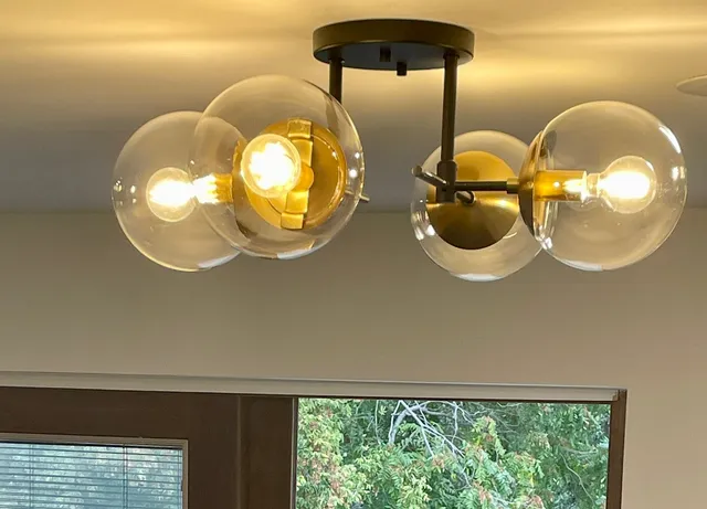 a view of an empty room with closet and wooden floor