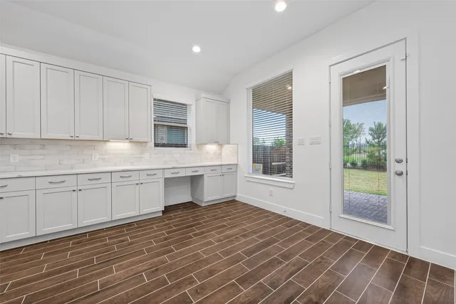 a kitchen with a sink and cabinets