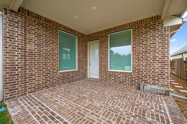 a view of a brick house with a door