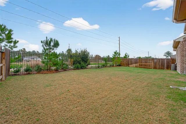 a backyard of a house with lots of green space