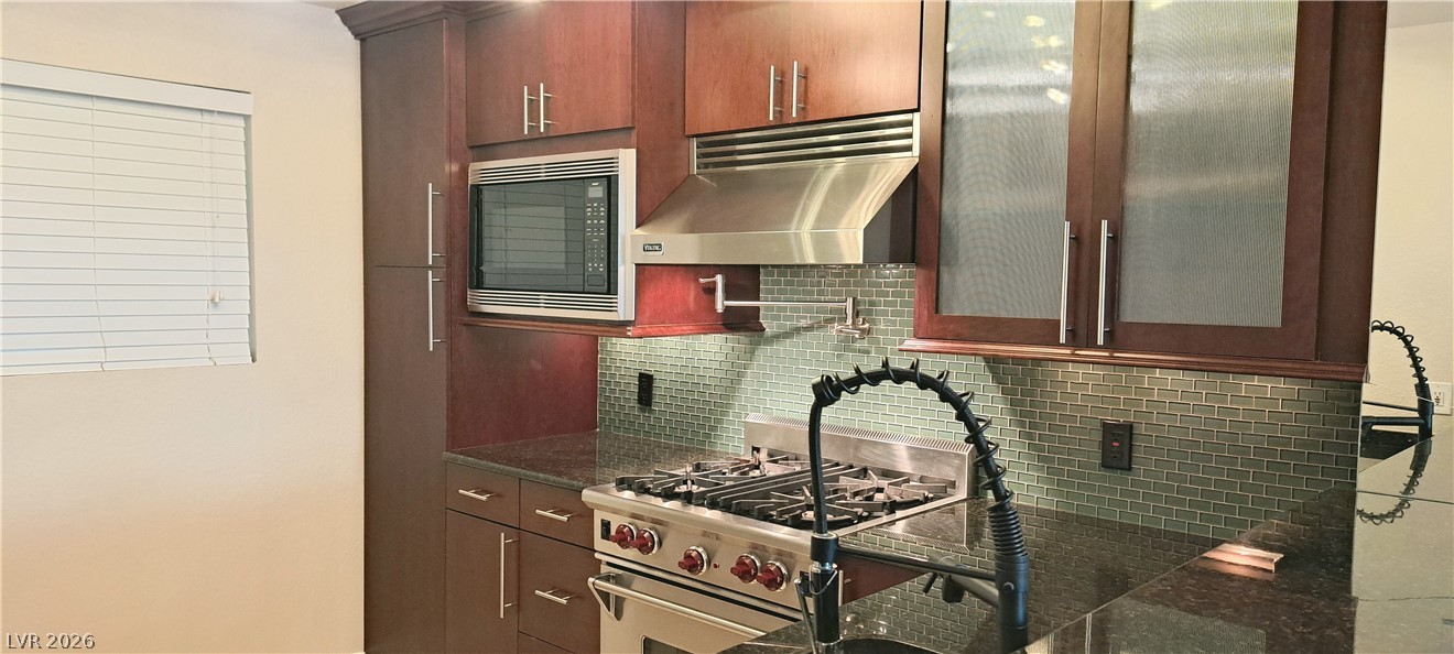 270 East Flamingo Road, Unit 227 Las Vegas, NV 89169 - Photo 3 of 12 Modern kitchen with sleek cabinetry and high-end appliances awaits culinary creativity.