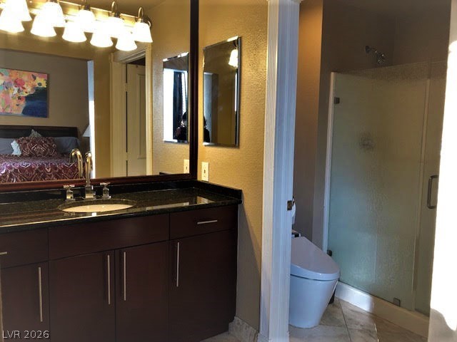 270 East Flamingo Road, Unit 227 Las Vegas, NV 89169 - Photo 5 of 12 This bathroom features a contemporary vanity and a spacious shower, reflecting modern design.