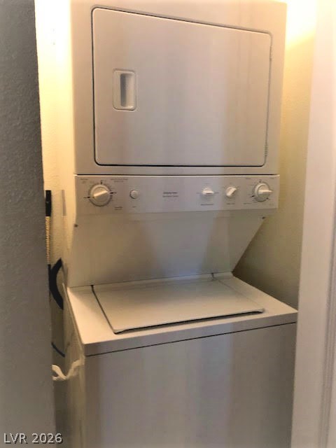 270 East Flamingo Road, Unit 227 Las Vegas, NV 89169 - Photo 8 of 12 This compact laundry area features a stacked washer and dryer, optimizing space efficiency for daily chores.