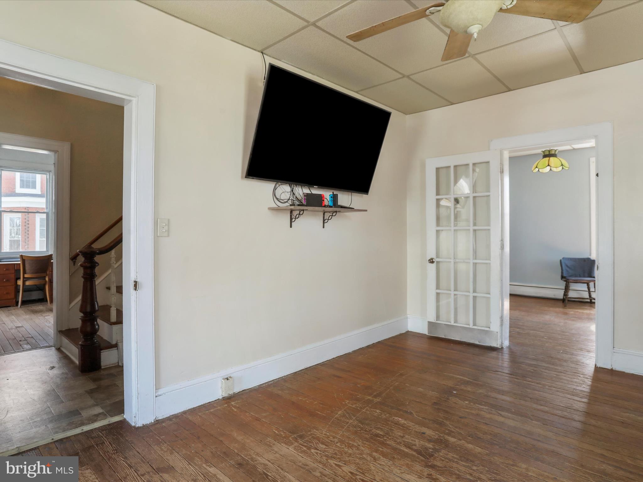 35 Middle Street Taneytown, MD 21787 - Photo 12 of 41 a view of a livingroom with wooden floor and a flat screen tv
