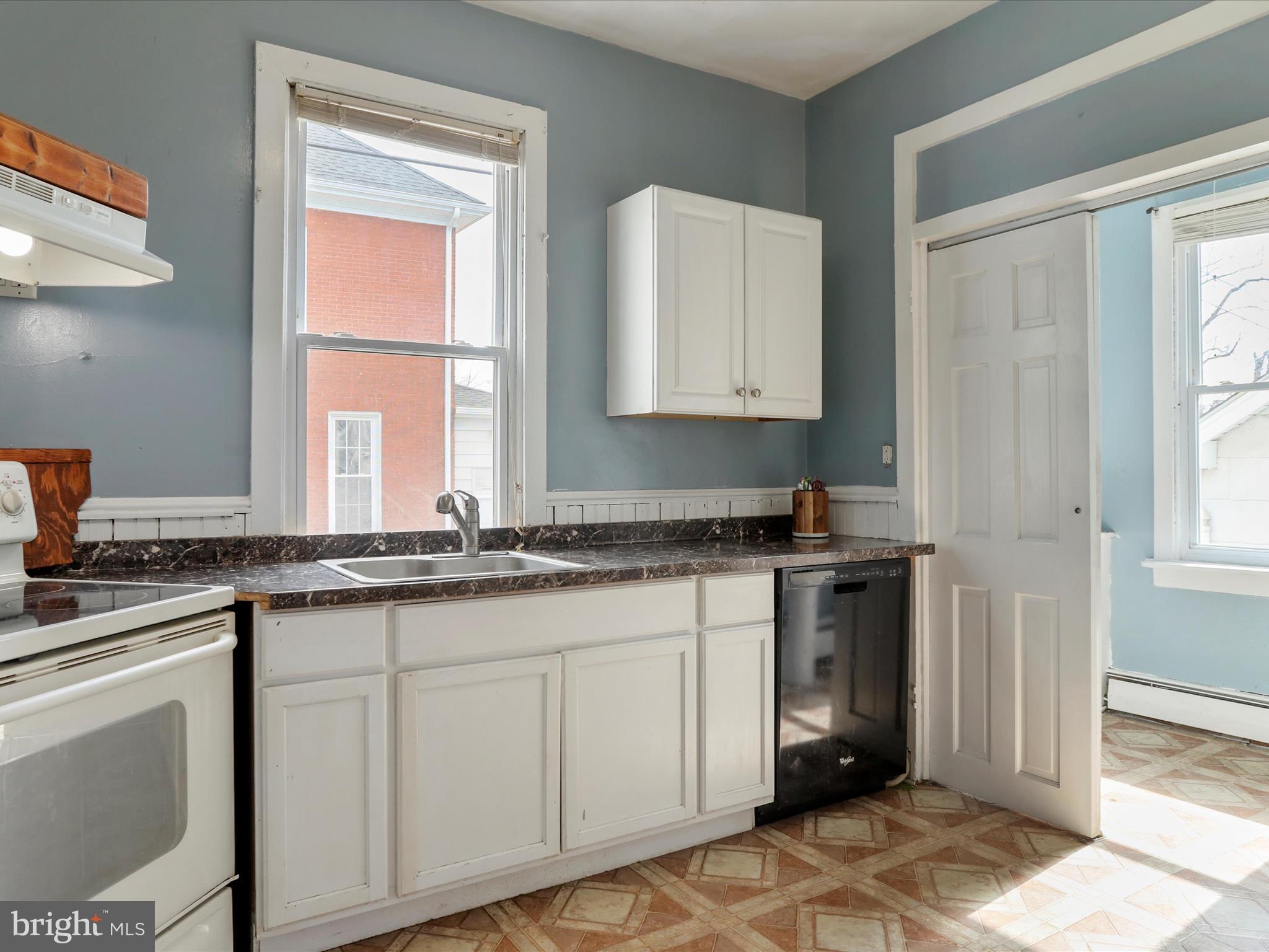 35 Middle Street Taneytown, MD 21787 - Photo 17 of 41 a kitchen with granite countertop white cabinets and white appliances