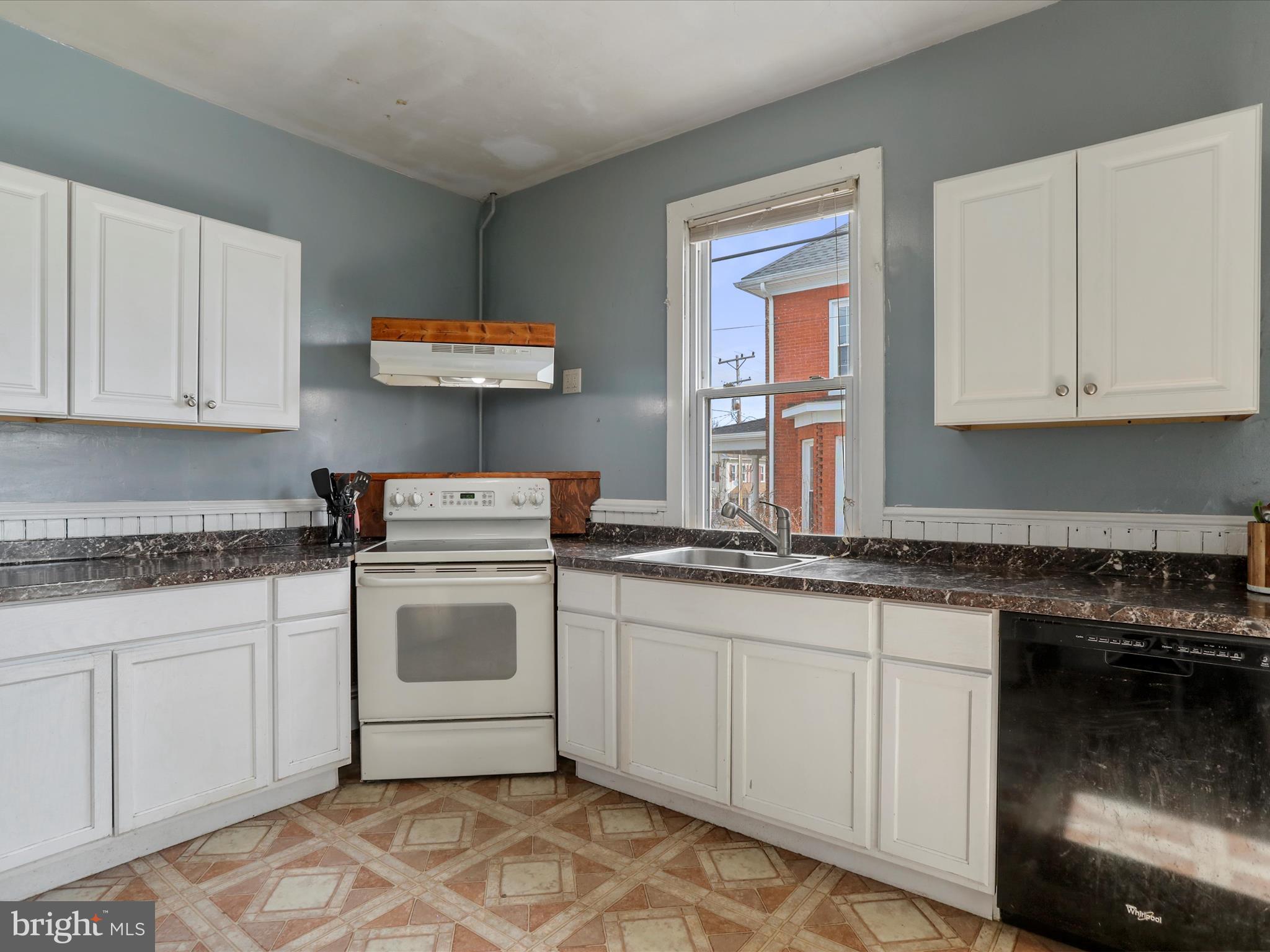 35 Middle Street Taneytown, MD 21787 - Photo 18 of 41 a kitchen with stainless steel appliances granite countertop a sink and cabinets with wooden floor