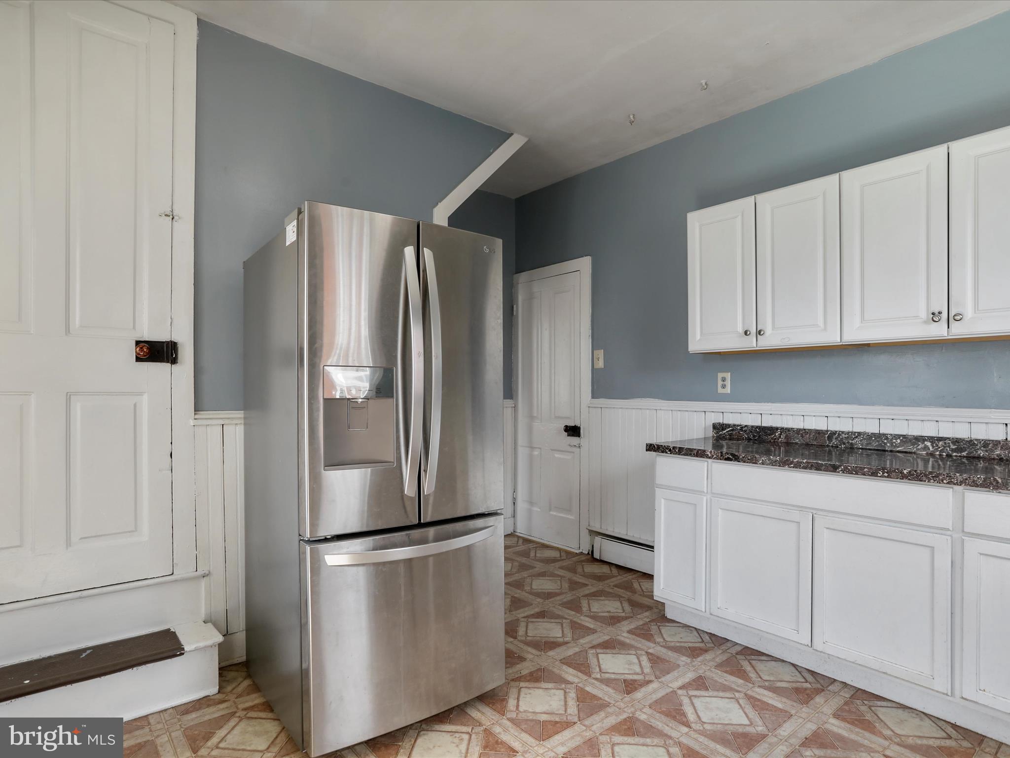 35 Middle Street Taneytown, MD 21787 - Photo 20 of 41 a metallic refrigerator freezer sitting in a kitchen