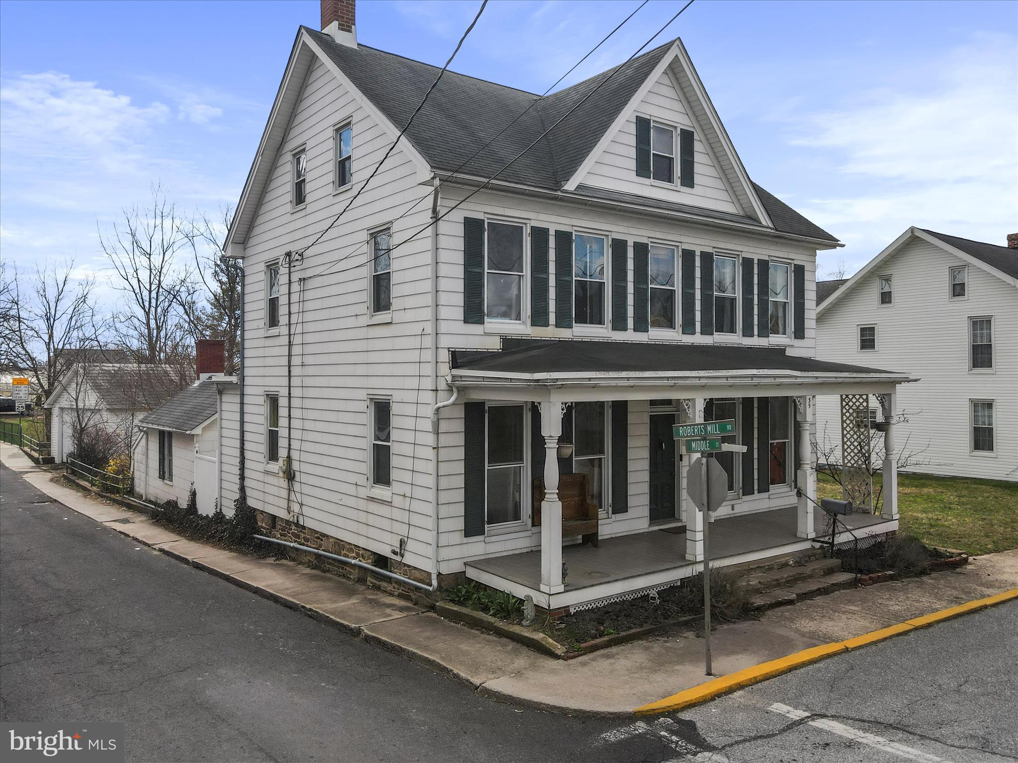 35 Middle Street Taneytown, MD 21787 - Photo 2 of 41 a view of a white house with large windows and wooden fence
