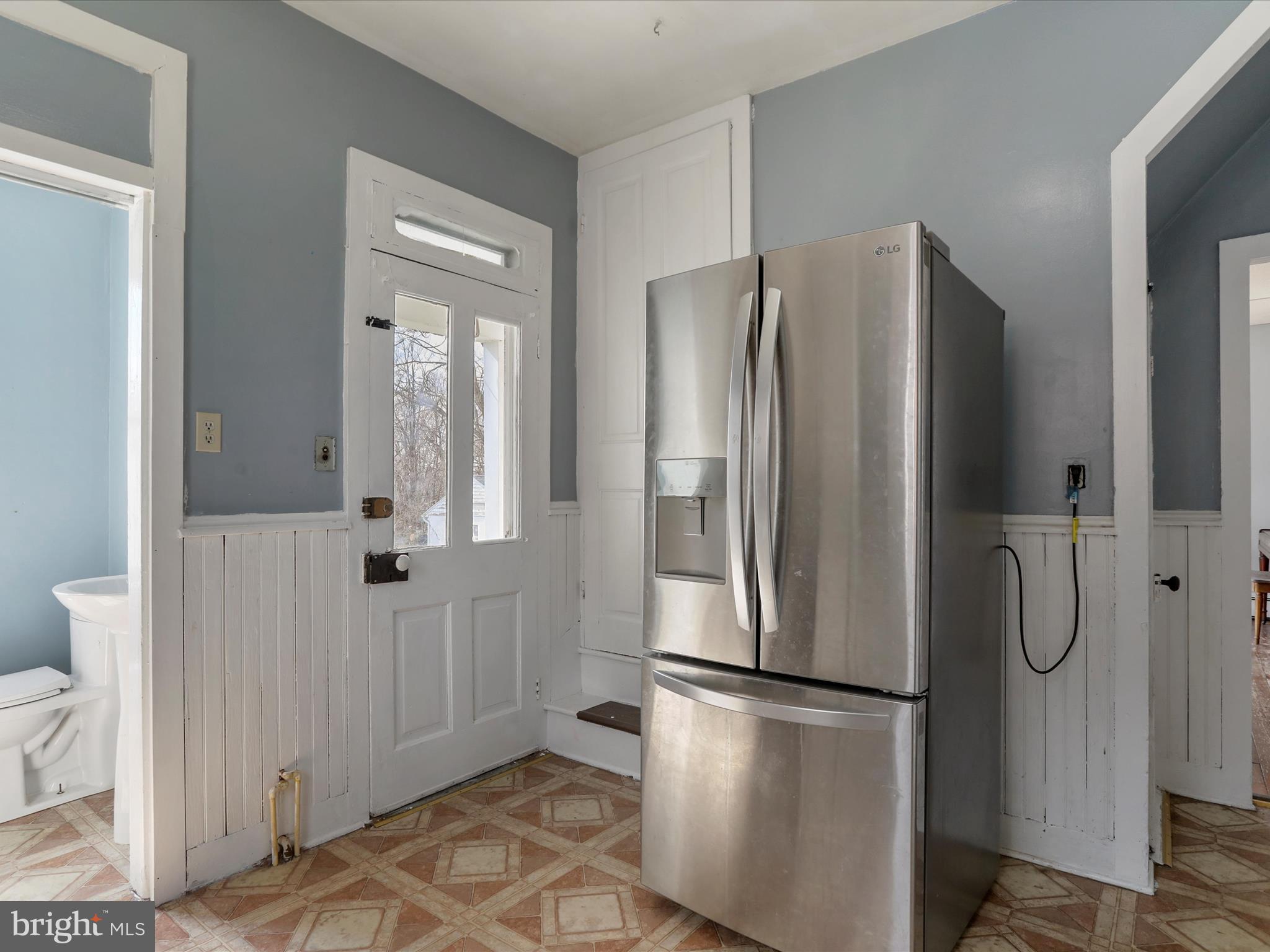 35 Middle Street Taneytown, MD 21787 - Photo 21 of 41 a white refrigerator freezer and a wooden floor