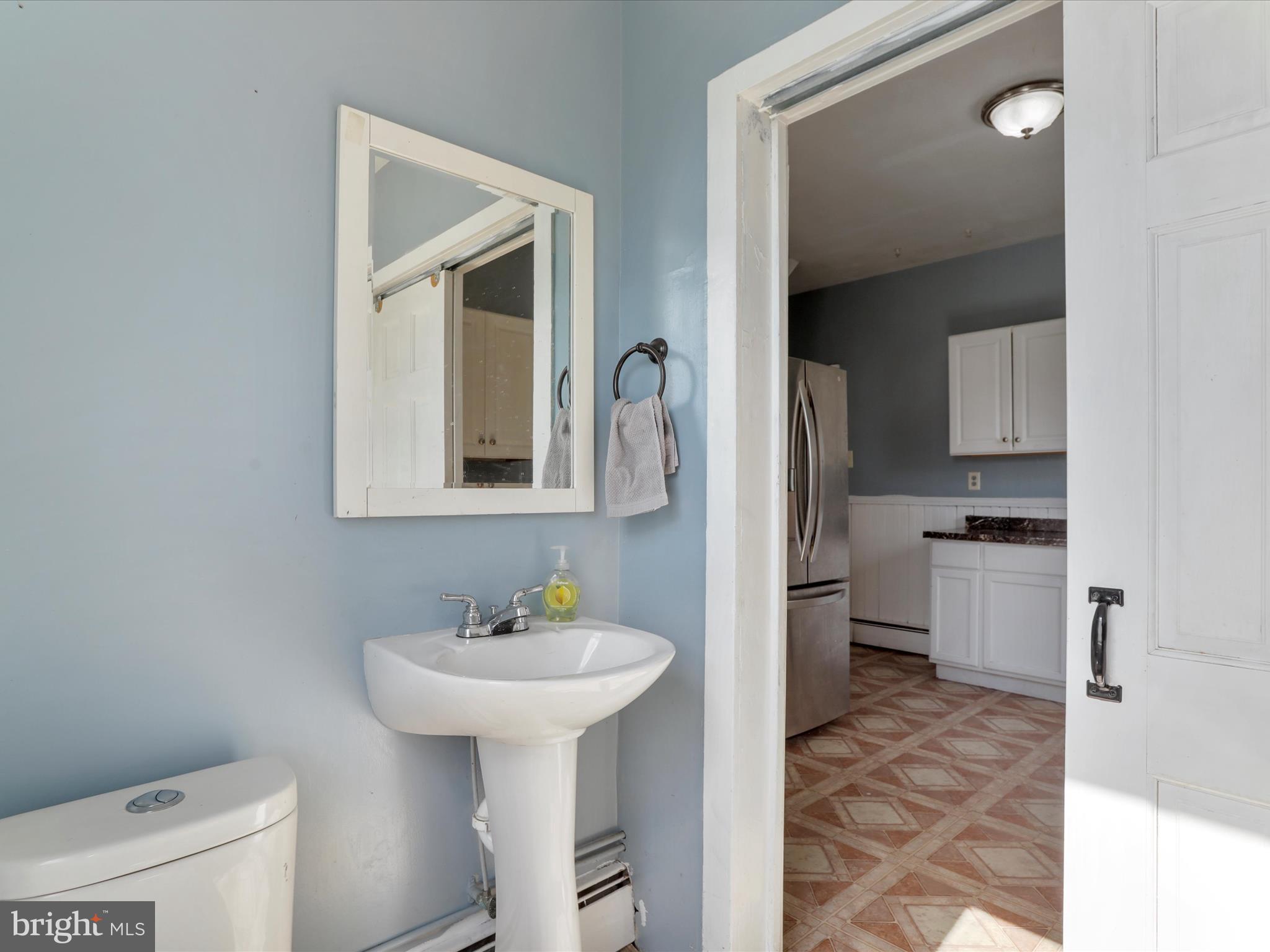 35 Middle Street Taneytown, MD 21787 - Photo 22 of 41 a bathroom with a sink toilet and a mirror