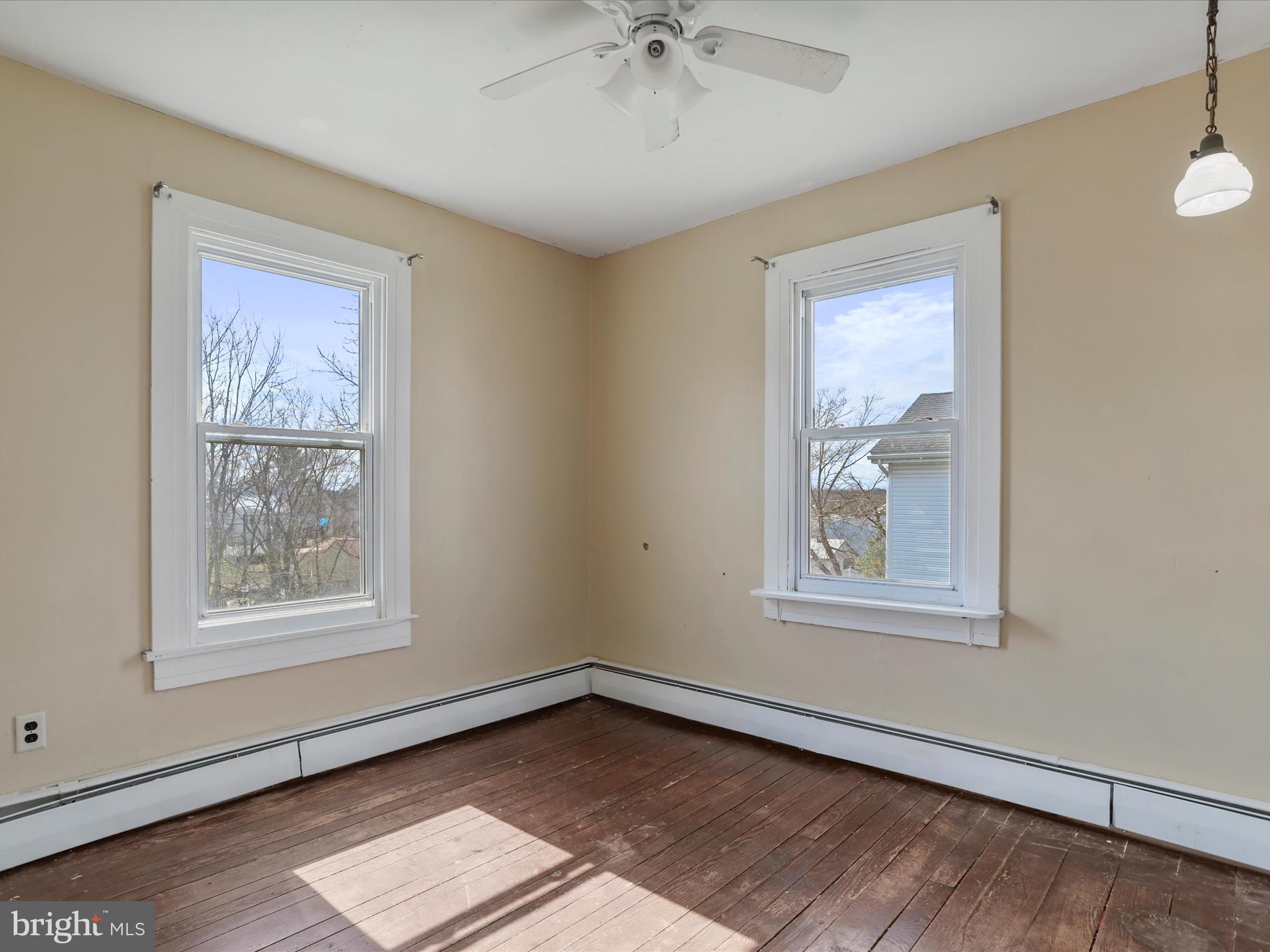 35 Middle Street Taneytown, MD 21787 - Photo 27 of 41 a view of an empty room with a window and wooden floor