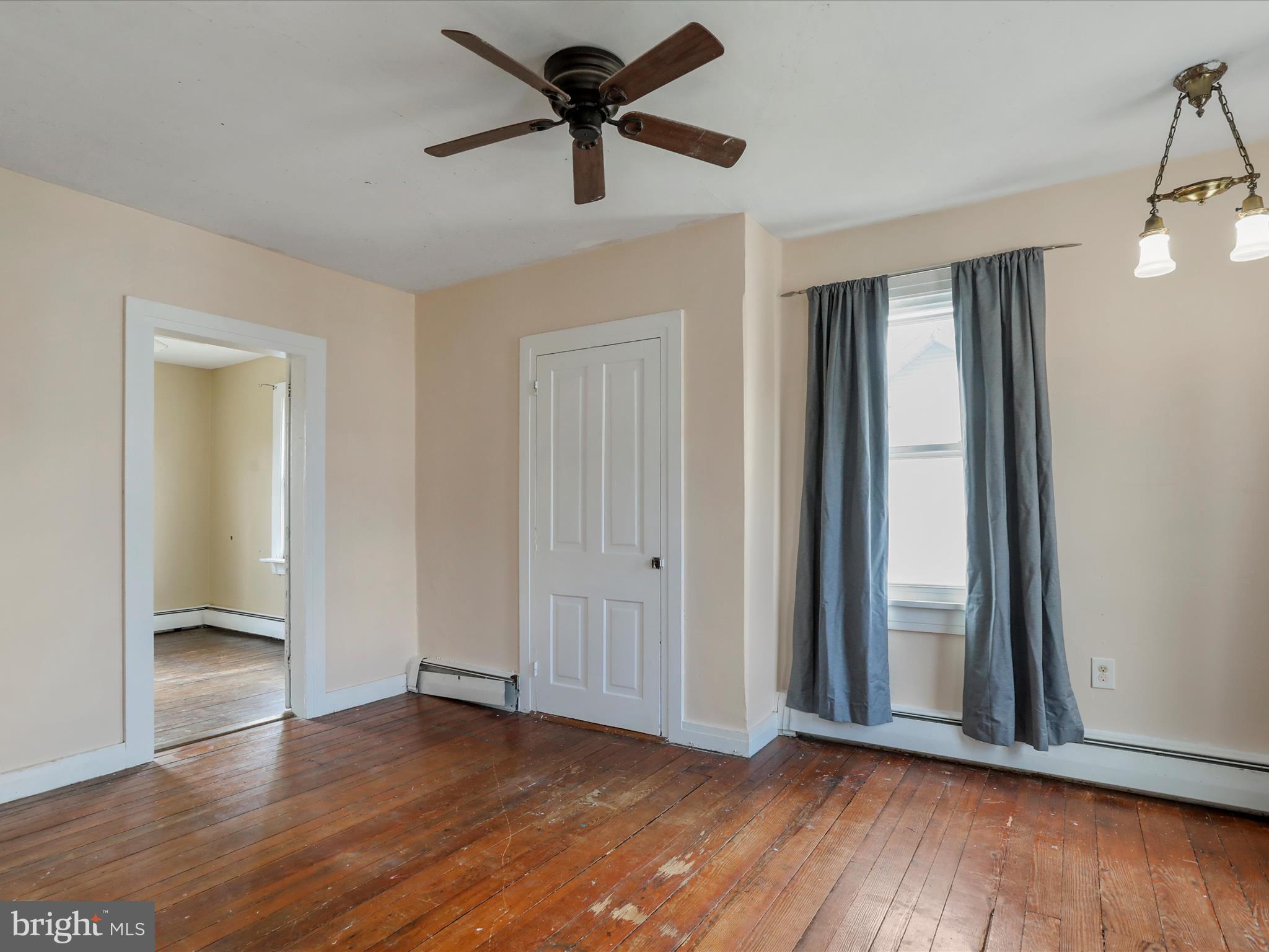 35 Middle Street Taneytown, MD 21787 - Photo 31 of 41 an empty room with wooden floor and windows