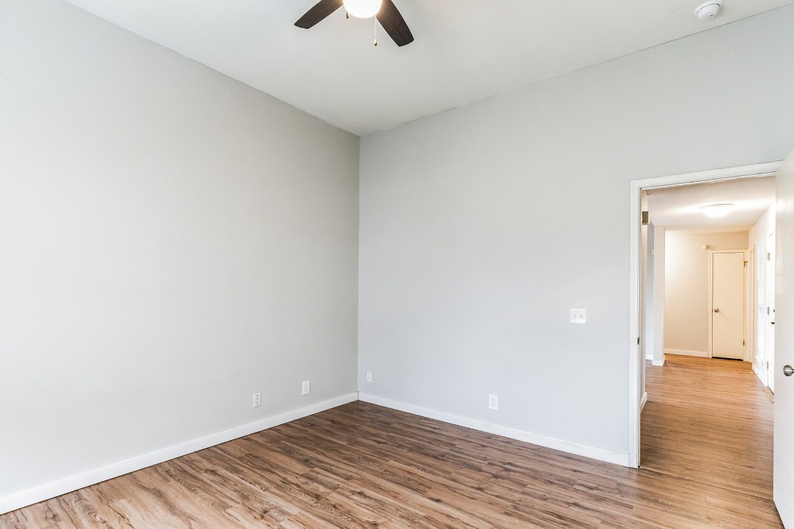 313 Caladium Drive Georgetown, TX 78626 - Photo 18 of 36 a view of an empty room with wooden floor