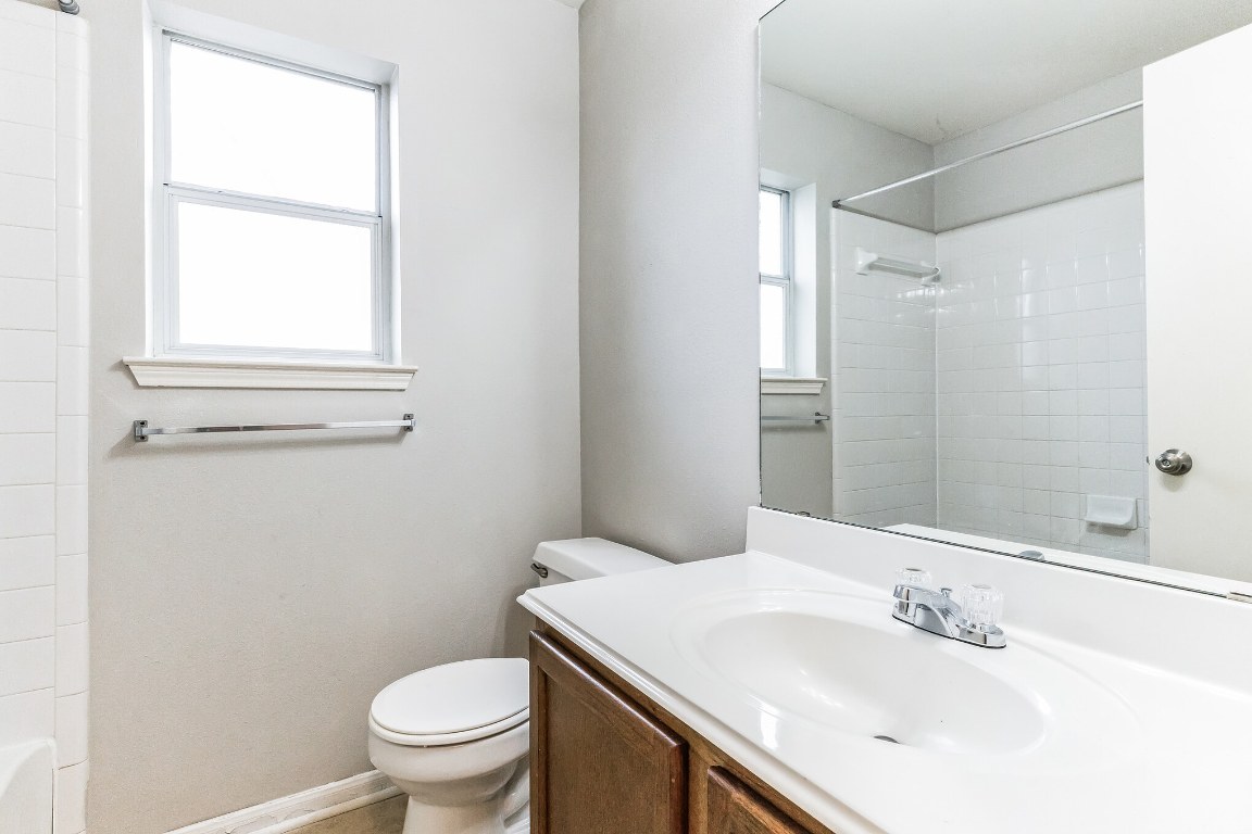 313 Caladium Drive Georgetown, TX 78626 - Photo 25 of 36 a bathroom with a sink a toilet and shower