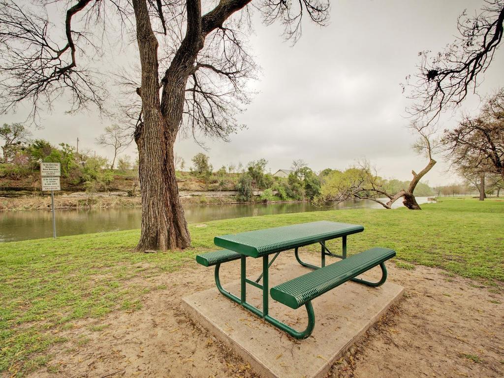 313 Caladium Drive Georgetown, TX 78626 - Photo 33 of 36 a view of lake with a table and chairs