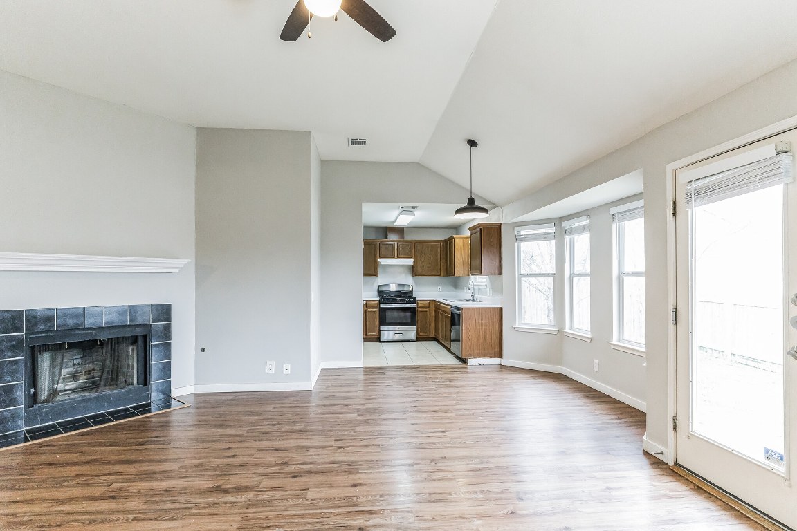 313 Caladium Drive Georgetown, TX 78626 - Photo 5 of 36 a view of an empty room with window and wooden floor