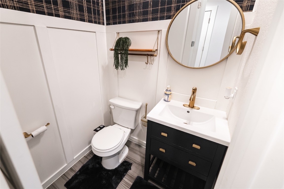 608 Pecan Bottom Trail Georgetown, TX 78628 - Photo 23 of 30 Half bath with vanity and wood finished floors