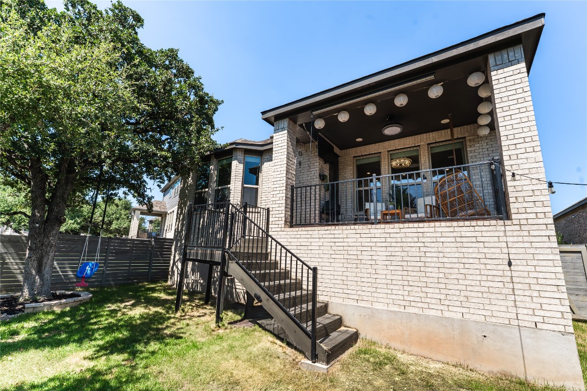 608 Pecan Bottom Trail Georgetown, TX 78628 - Photo 28 of 30 Back of house with brick siding and a balcony