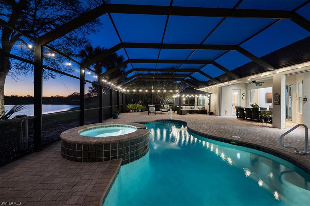 12080 Wicklow Lane Naples, FL 34120 - Photo 23 of 36 Night shot of pool lights and lanai
