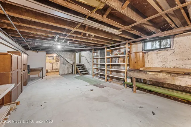 a view of a house with a swimming pool and a yard