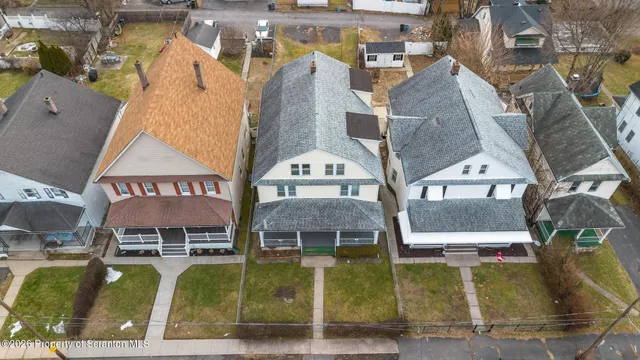 an aerial view of a house with swimming pool