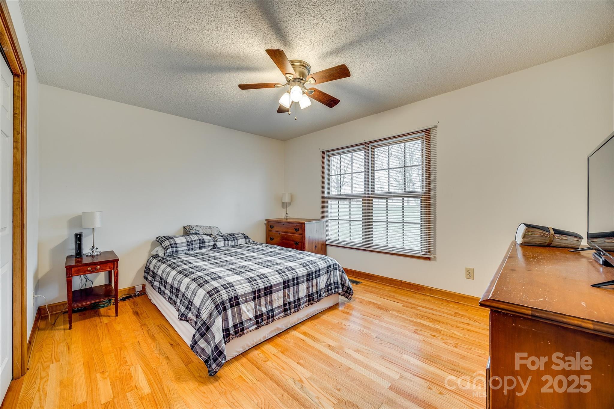 1221 Edgefield Road York, SC 29745 - Photo 23 of 38 a bedroom with a bed and a chandelier