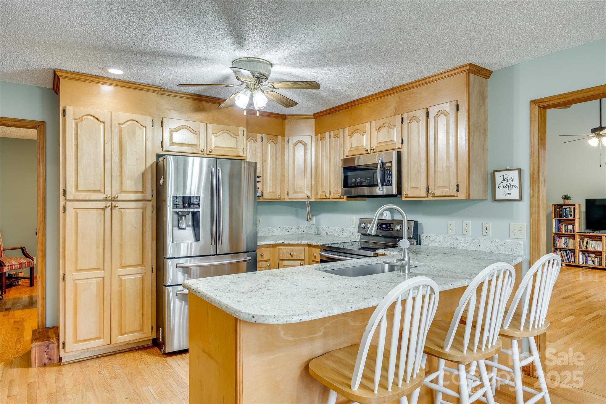 1221 Edgefield Road York, SC 29745 - Photo 8 of 38 a kitchen with stainless steel appliances granite countertop a sink refrigerator and microwave