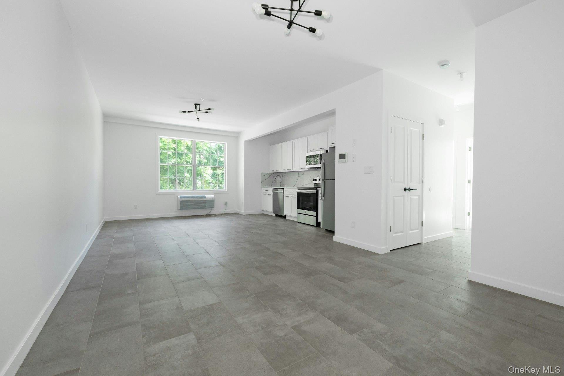 962 Rte 9W, Unit 106 Congers, NY 10920 - Photo 9 of 48 an empty room with windows and closet