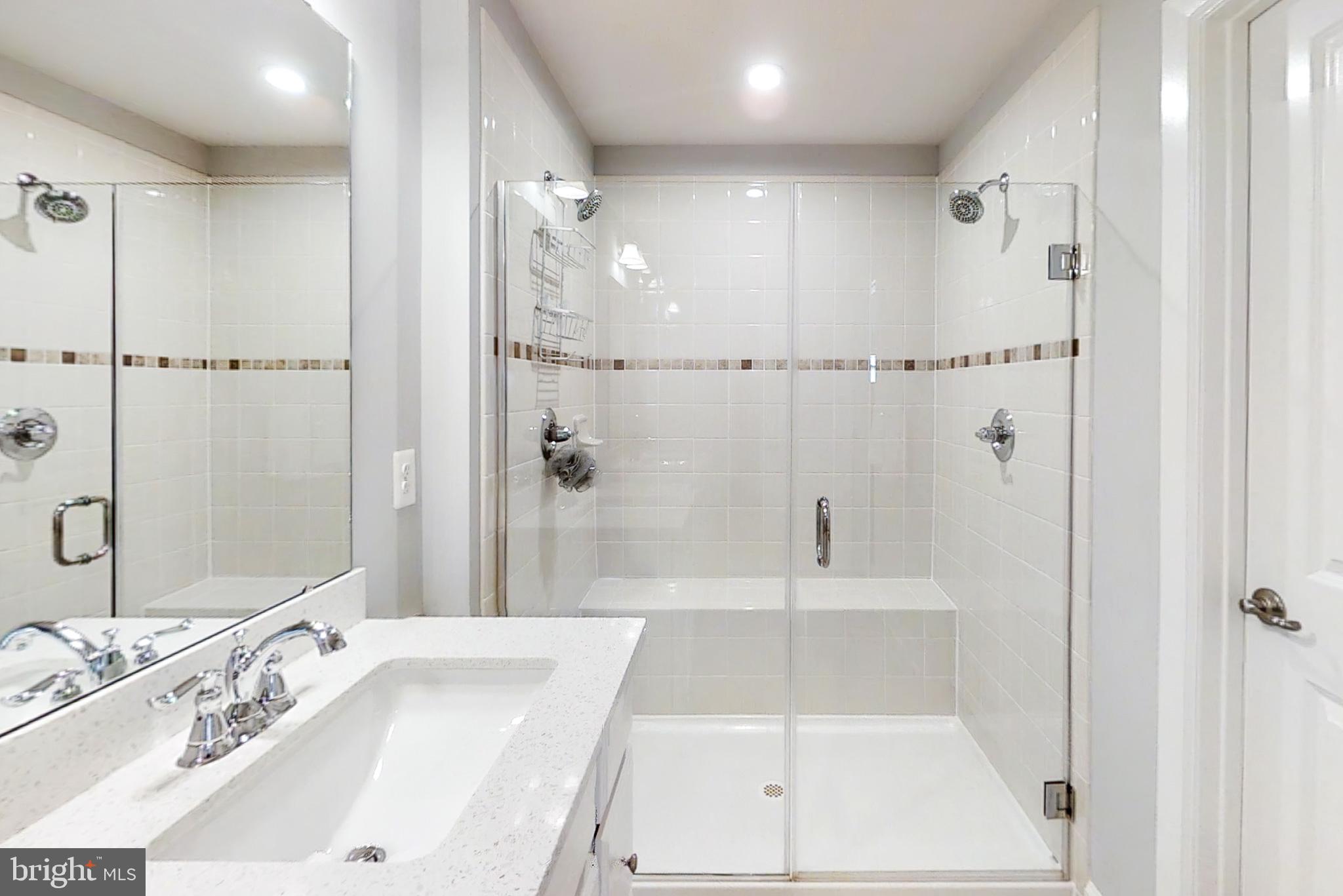 22170 Maple Tree Terrace Ashburn, VA 20148 - Photo 18 of 45 Frameless Glass Shower, Seat, Dual Shower Heads