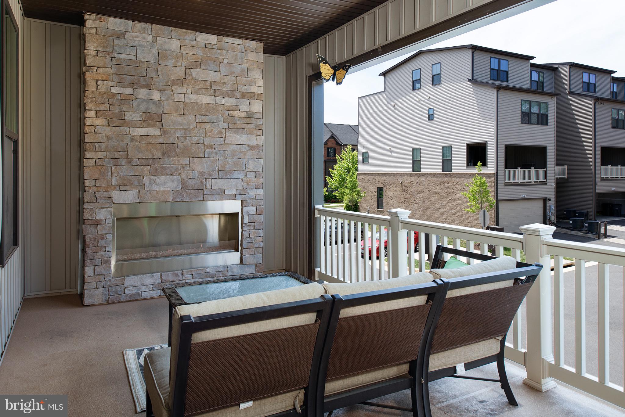22170 Maple Tree Terrace Ashburn, VA 20148 - Photo 3 of 45 Covered Deck with Lighted Flr-Ceiling Stone Gas FP