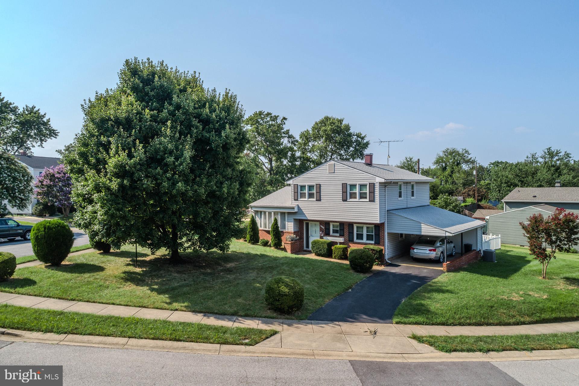 208 Ardmore Road Linthicum Heights, MD 21090 - Photo 1 of 58 a front view of a house with a yard