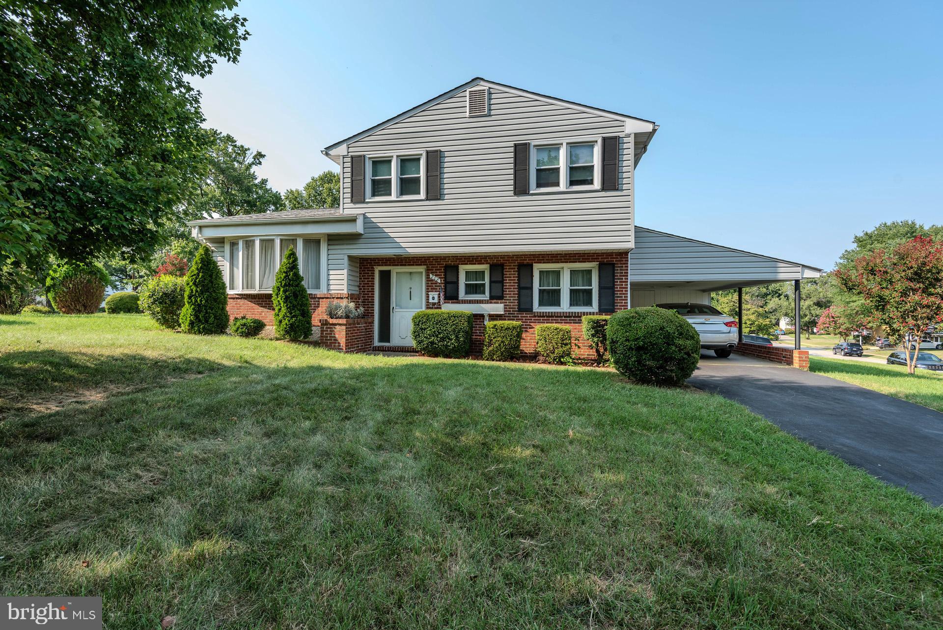 208 Ardmore Road Linthicum Heights, MD 21090 - Photo 2 of 58 a front view of a house with a yard and trees