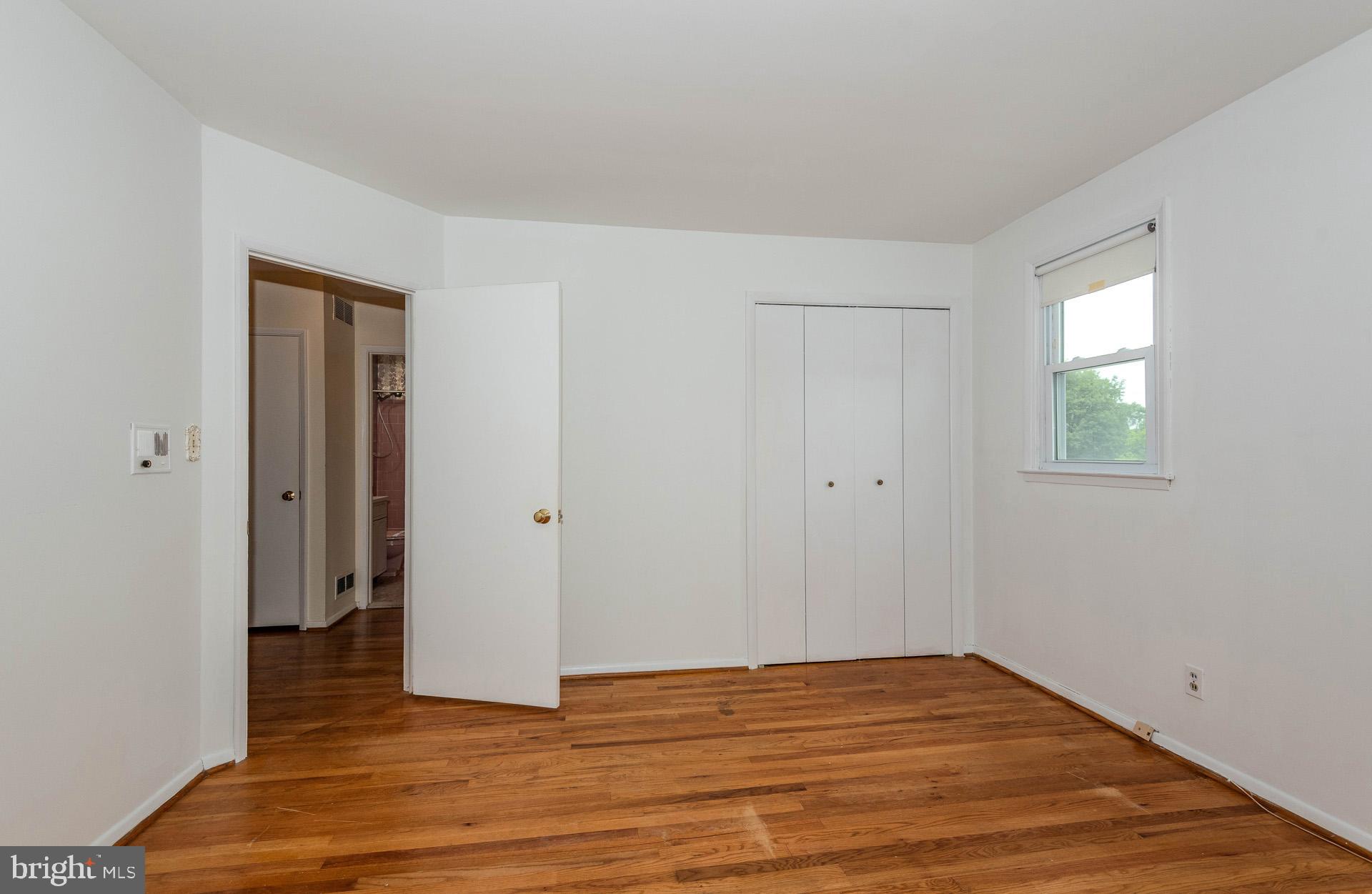 208 Ardmore Road Linthicum Heights, MD 21090 - Photo 24 of 58 a view of an empty room with wooden floor and closet