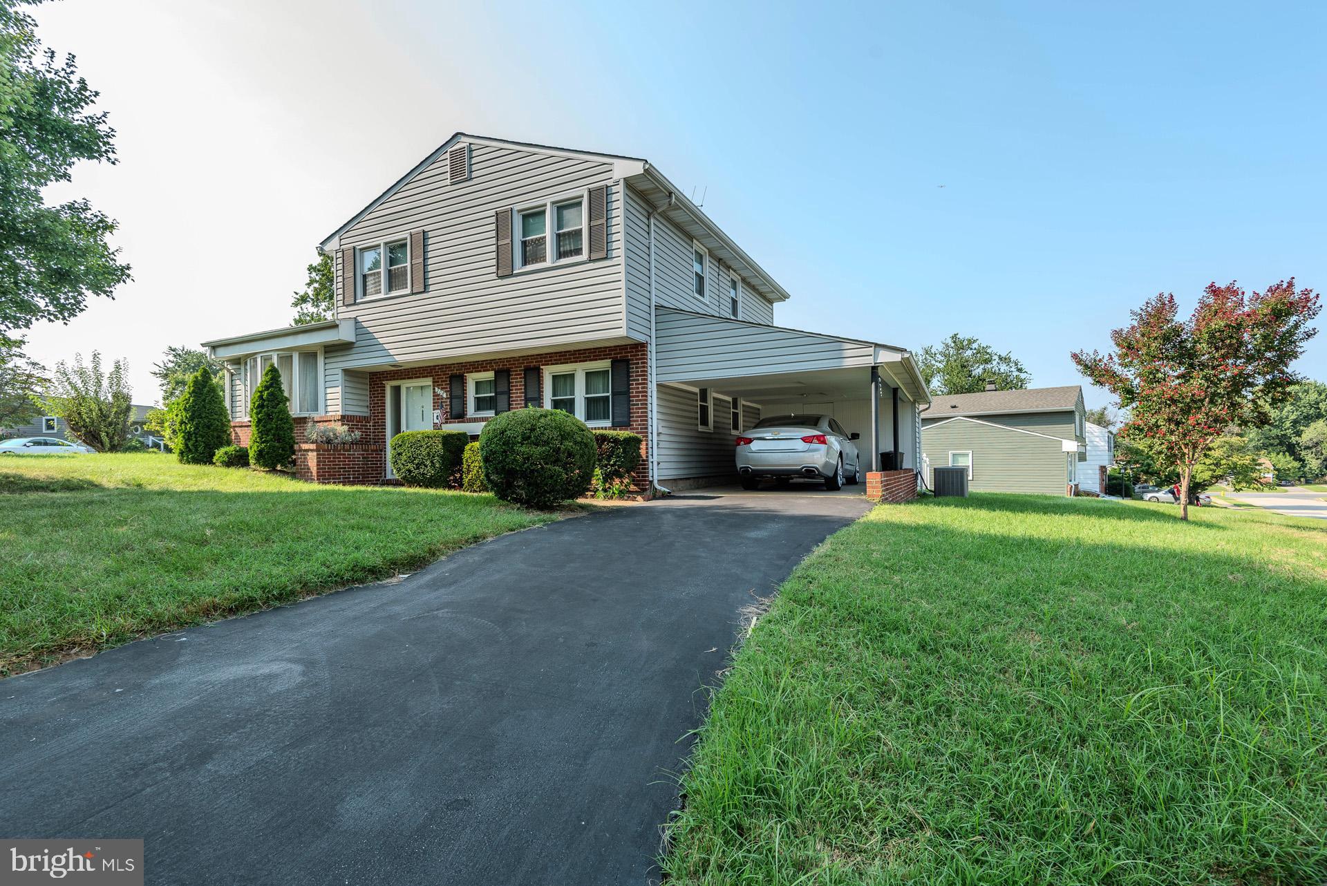 208 Ardmore Road Linthicum Heights, MD 21090 - Photo 3 of 58 a front view of a house with a yard and garage