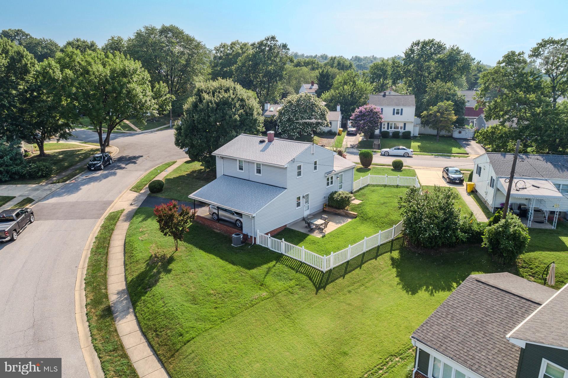 208 Ardmore Road Linthicum Heights, MD 21090 - Photo 31 of 58 an aerial view of a house with swimming pool and trees