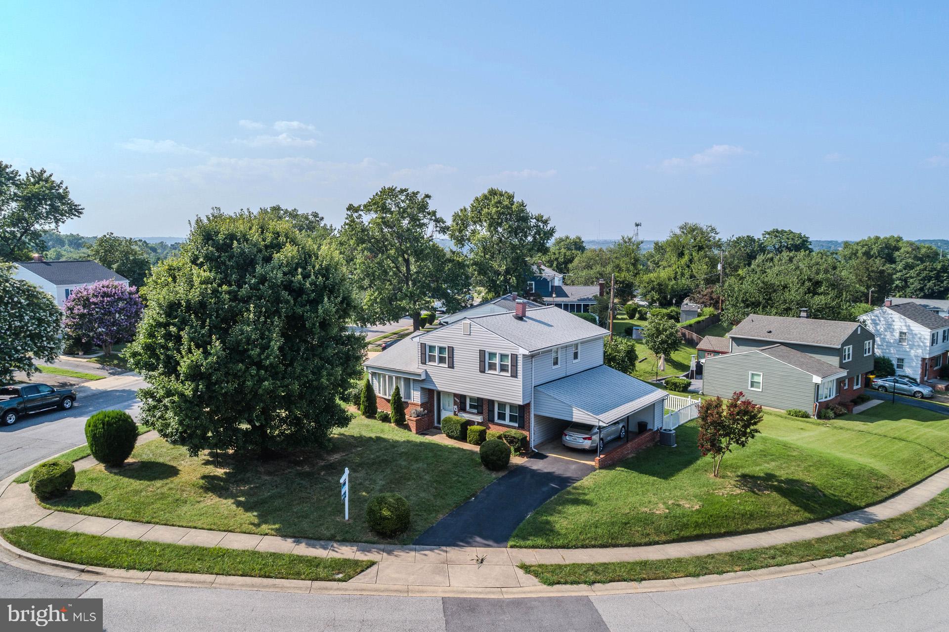 208 Ardmore Road Linthicum Heights, MD 21090 - Photo 5 of 58 a aerial view of a house with a garden and trees