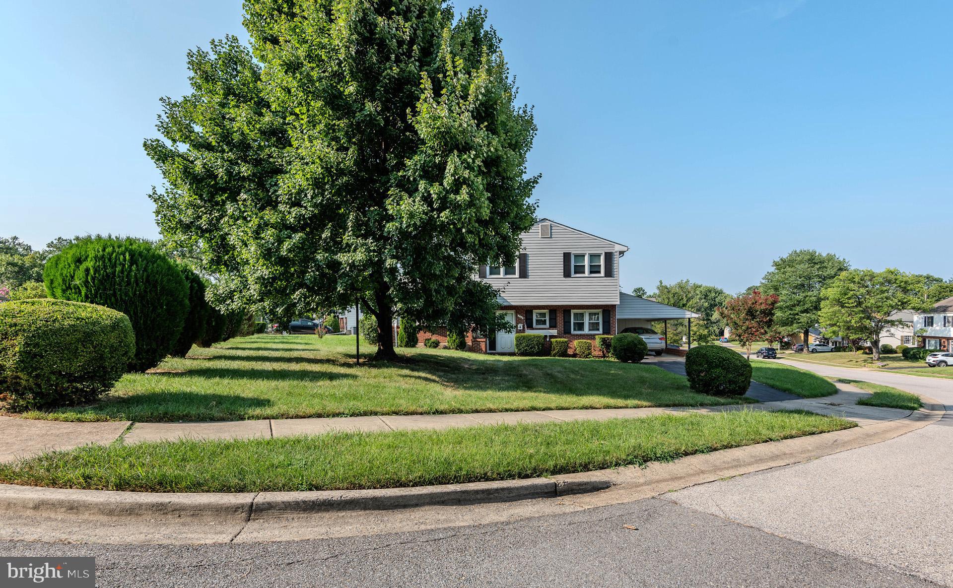 208 Ardmore Road Linthicum Heights, MD 21090 - Photo 51 of 58 a front view of a house with a yard