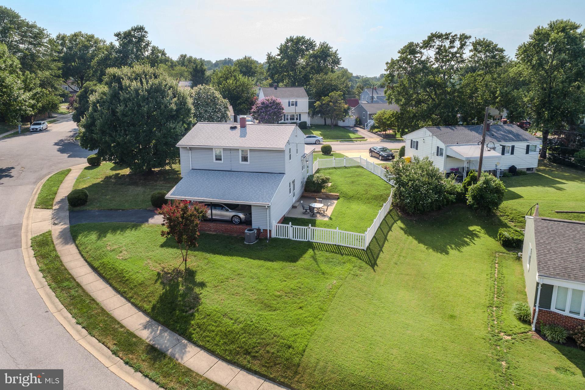 208 Ardmore Road Linthicum Heights, MD 21090 - Photo 7 of 58 an aerial view of a house with swimming pool and a yard